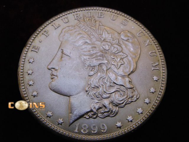 Lot 36-486369 - AU/BU 1899-O Morgan Silver Dollar.  Full Breast Feathers.