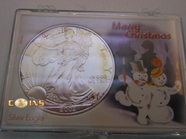 Lot 36-486718 - UNC/BU 2002 Silver American Eagle in Christmas Holder.