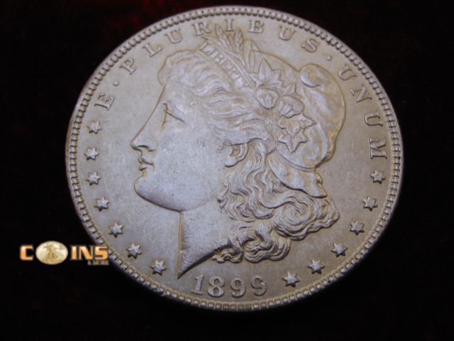 Lot 36-238160 - AU+ SEMI-KEY 1899 Morgan Silver Dollar. Full Breast Feathers.