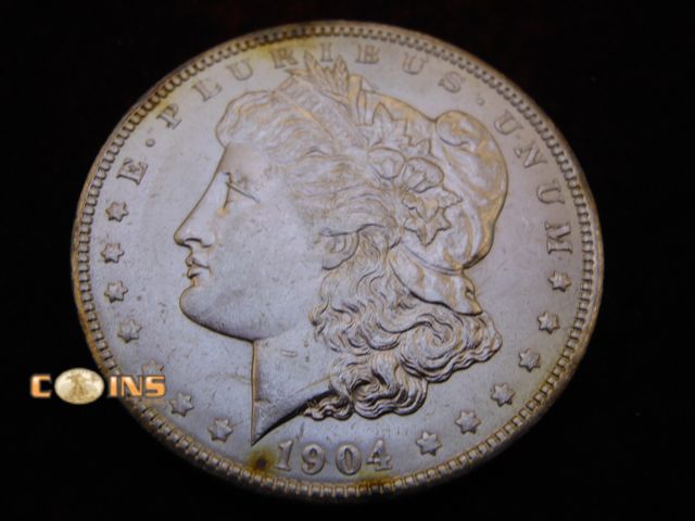Lot 36-486368 - UNC/BU 1904-O Morgan Silver Dollar.  Full Breast Feathers.