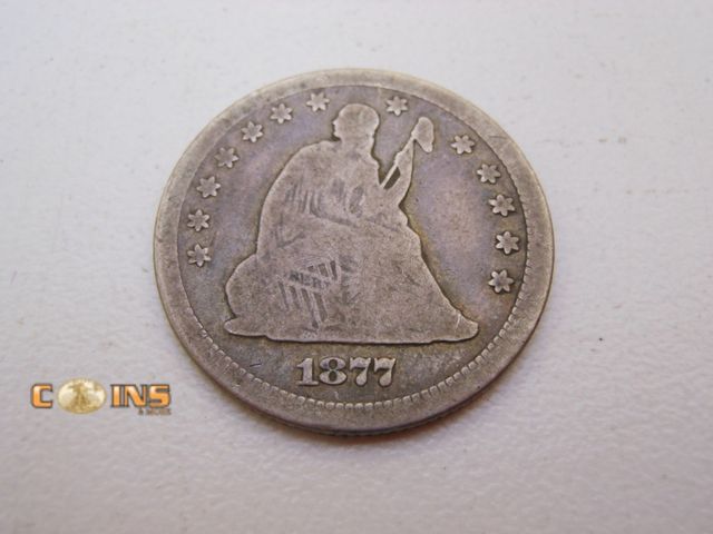 Lot 36-486766 - Better 1877-CC Silver Seated Quarter Dollar.