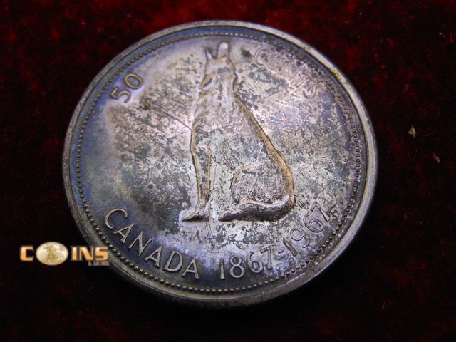 Lot 36-486570 - UNC/BU Proof Like Toned 1867 Silver Canadian Half Dollar.