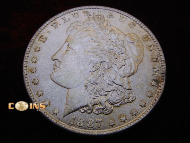 Lot 36-087093 - AU+ 1887 Morgan Silver Dollar.