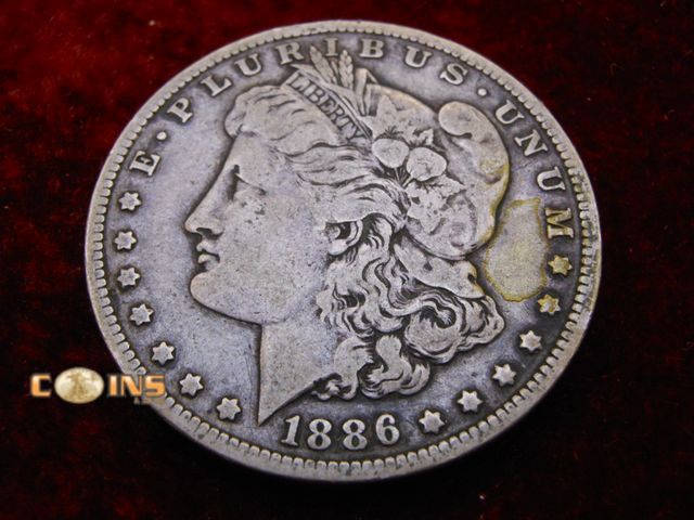 Lot 36-486214 - Beter Date 1886-O Morgan Silver Dollar.