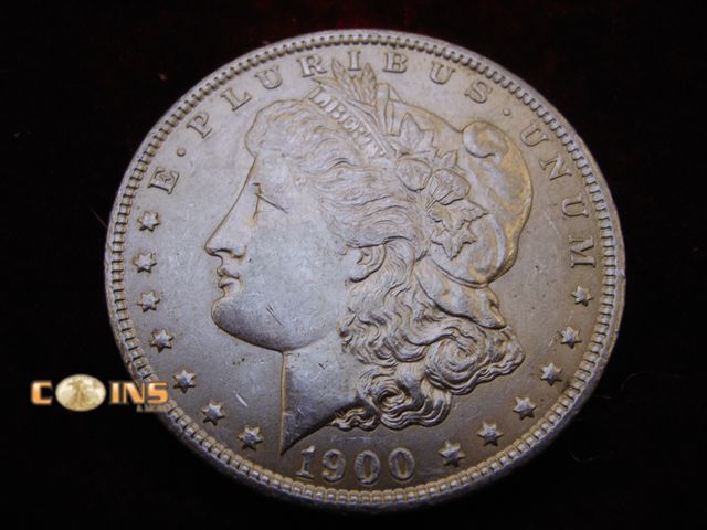 Lot 36-238227 - AU/UNC 1900-O Morgan Silver Dollar, Full Breast Feathers.