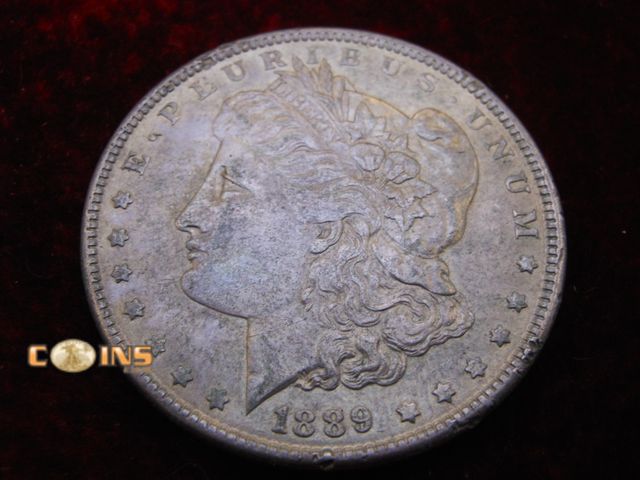 Lot 36-486405 - Better 1889 Morgan Silver Dollar.  Full Breast Feathers.