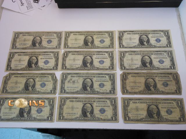 Lot 36-487790 - Lot of Twelve Blue Seal $1 Silver Certificates, All 1935 With One 1957.