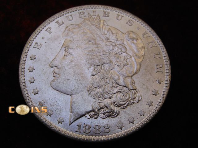 Lot 36-486394 - UNC/BU 1882-O DMPL Morgan Silver Dollar.  Full Breast Feathers.