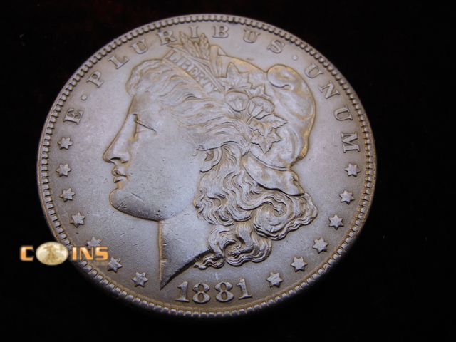 Lot 36-087110 - AU 1881 Morgan Silver Dollar.