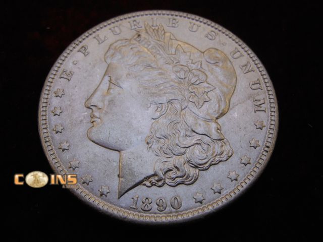 Lot 36-087102 - AU+ 1890 Morgan Silver Dollar.