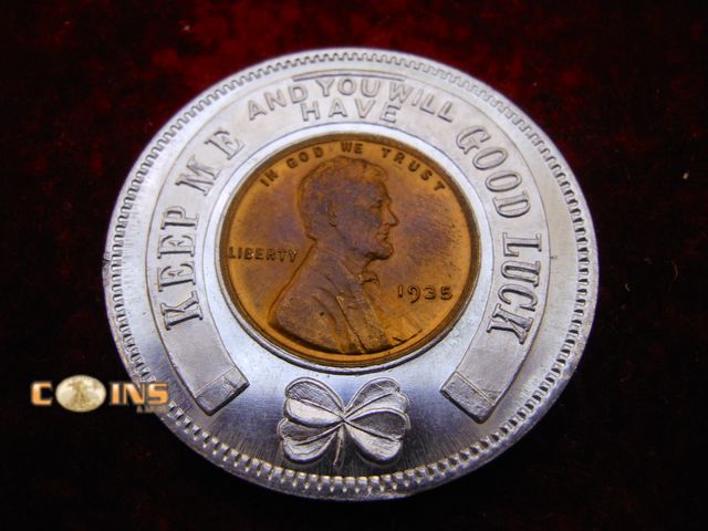 Lot 36-086799 - UNC 1935 Wheat Cent Encapsulated in "Keep Me and Never Go Broke" Round.