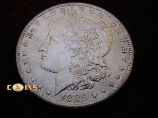 Lot 36-087120 - AU/UNC 1885-O Morgan Silver Dollar.