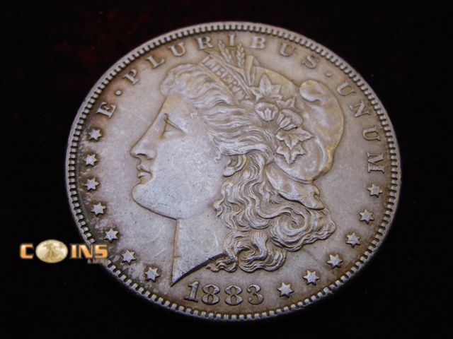 Lot 36-087115 - AU 1883 Morgan Silver Dollar.