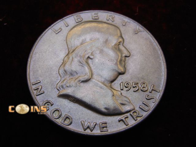 Lot 36-486497 - AU 1958-D Silver Franklin Half Dollar. Full Bell Lines Visible.