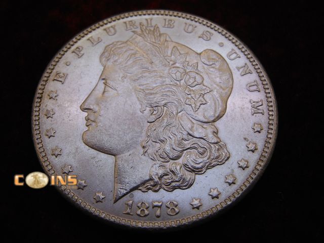 Lot 36-086644 - AU+ 1878-S Morgan Silver Dollar.