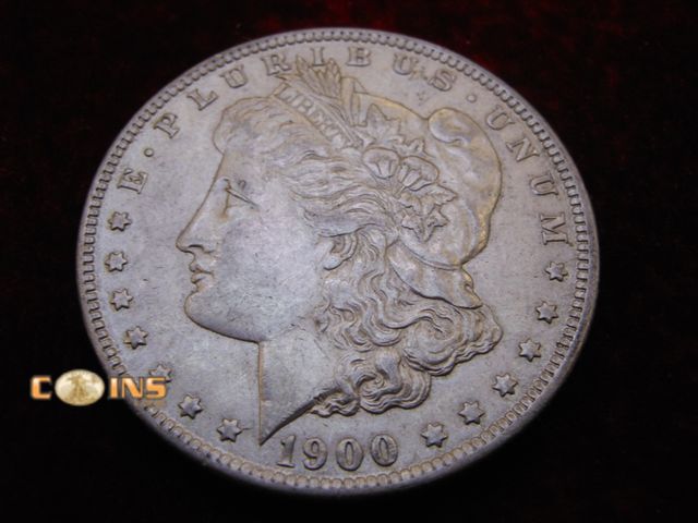 Lot 36-486395 - AU+ 1900-O Morgan Silver Dollar.  Full Breast Feathers.
