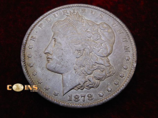 Lot 36-486385 - BETTER 1878-CC Morgan Silver Dollar.
