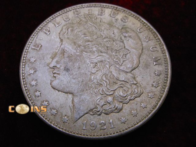 Lot 36-486377 - UNC/BU 1821 Morgan Silver Dollar.  Full Breast Feathers.