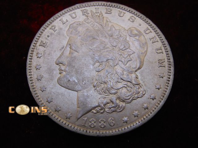 Lot 36-087092 - RARE IN THIS CONDITION AU+ 1886-O Morgan Silver Dollar.