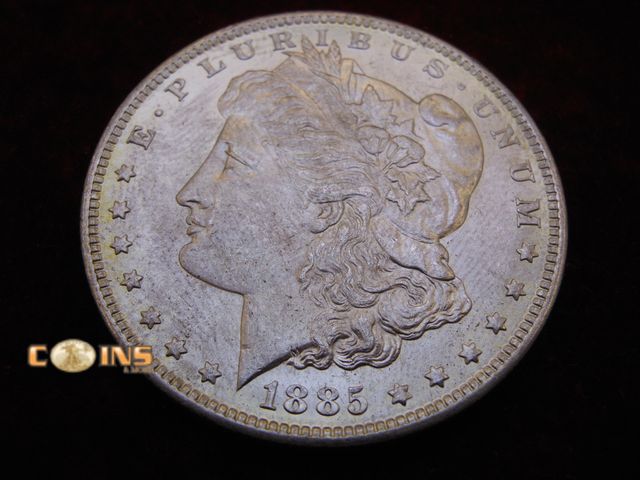 Lot 36-486403 - AU+ 1885-O Morgan Silver Dollar.  Full Breast Feathers.