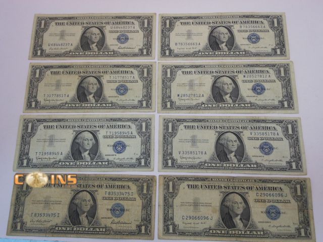 Lot 36-238199 - Lot of Eight Blue Seal $1 Silver Certificates.