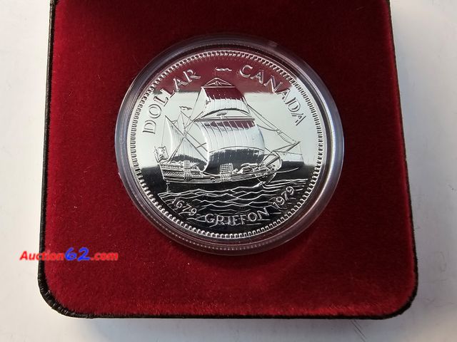 Lot 44-8304v - 1979 CANADA SILVER DOLLAR COMMEMORATING THE 300TH ANNIVERSARY OF THE GRIFFON. HAS .375 TROY OUNCES OF SILVER. COMES IN A NICE DISPLAY BOX AN...