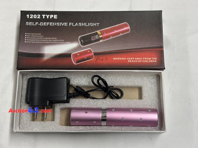 Lot 44-6143o - Type 1202 self defense flashlight and taser rechargeable. Opened for photo. Pre-priced $20 from store closing. See All Photo's Not Tested Ne...