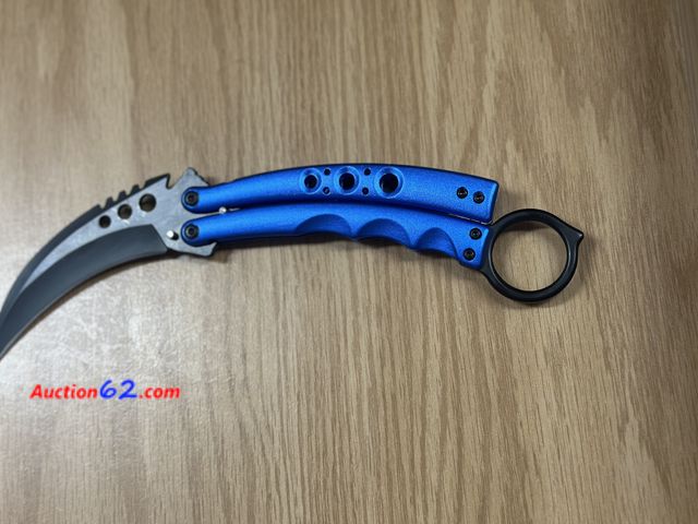 Lot 44-6134q - Blue color butterfly knife with belt clip. Very nice. New. Pre-priced $32 from store closing. See All Photo's Tested & Working Never opened,...