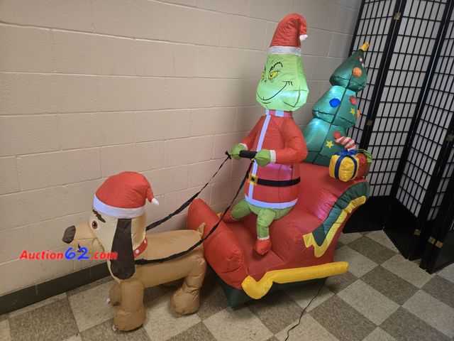 Lot 44-6574t - 6ft Grinch Christmas Inflatable Outdoor Decorations, Inflatable with LED Lights Appears New, A basic inspection has been given to this item....