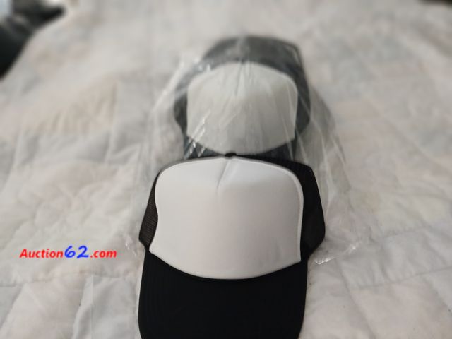 Lot 44-2318b - Twelve new black and white nesh hats.  Perfect. For logos or designs.  See photos. 1. Appears New, A basic inspection has been given to this...