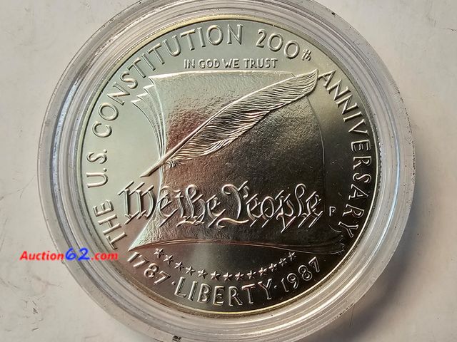 Lot 44-8362u - 1987 WE THE PEOPLE CONSTITUTION 90% SILVER COMMEMORATIVE DOLLAR. BRILLIANT UNCIRCULATED. COMES IN AN AIR-TITE CAPSULE. MINTED IN PHILADELPHI...