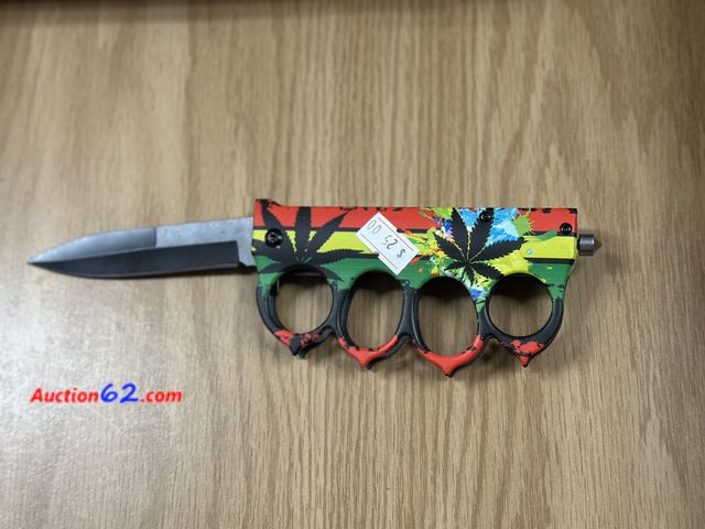 Lot 44-6166q - Finger knife with decorative flower print. Lock blade. With belt clips and glass breaker. Pre tagged $20 from store closing. New. See All Ph...