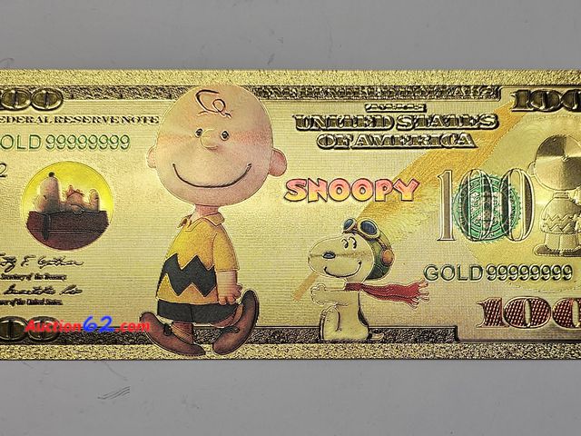 Lot 44-8301q - SNOOPY AND CHARLIE BROWN PEANUTS GOLD PLATED 100 REPLICA NOTE. THE REVERSE HAS TONS OF PEANUTS CHARACTERS.-T