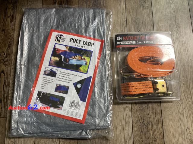Lot 44-2101f - New. 8 ft X 10 ft poly tarp. Resistant to water, tearing, sun and fading. No Leaks. No tears. Rope reinforced hem. Reinforced corners.  2 in...