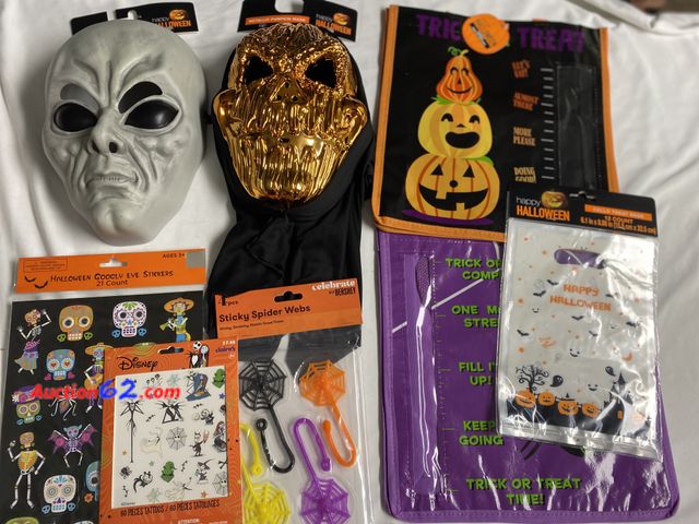 Lot 44-3627m - Alien glow in the dark mask. Metallic pumpkin mask. Two trick or treat bags. Package of 12 cello treat bags. Disney 60 pc Nightmare before C...