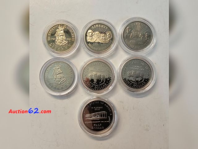 Lot 44-8310v - SEVEN (7) CLAD HALF DOLLARS-TWO CONGRESS, FOUR MOUNT RUSHMORE AND ONE WRIGHT BROTHERS. SOME ARE BRILLIANT UNCIRCULATED AND SOME ARE PROOFS.-...