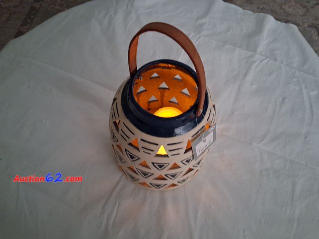 Lot 44-2021o - New heavy outdoor light, tag price 20.00, measure approximately 14" tall with handle. One new battery operated candle.  See photos. Appears ...