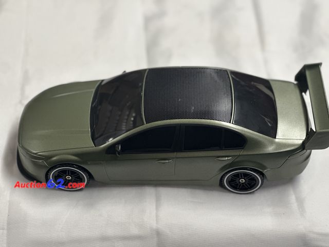 Lot 44-6142w - Bluetooth speaker car shaped. From gadgets and more. Solar rechargeable, 8W built in microphone 1200 MAH BATTERY. USB charger. Opened for ph...