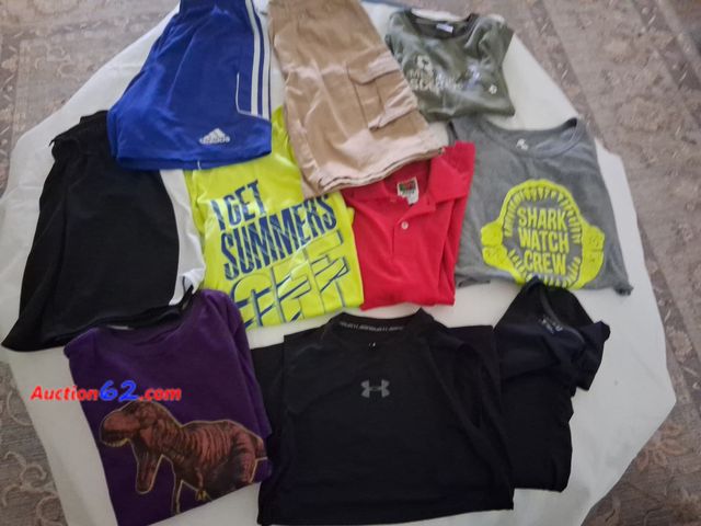 Lot 44-2015o - Boys 10/12 gently used clothes lot.  One pair of Adidias boys youth medium shorts.  One khaki boys shorts 10/12.  One youth medium Under Arm...