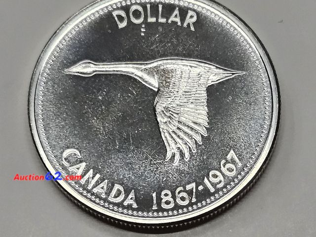 Lot 44-8325q - 1967 CENTENNIAL CANADIAN SILVER GOOSE DOLLAR. CONTAINS .6 OUNCES OF SILVER!! BRILLIANT UNCIRCULATED.- T