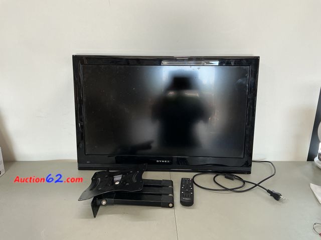 Lot 44-1501b - Dynex 30 Inch tv with wall mount part and remote- works for DMI, Roku, cable, and antenna- missing hardware for wall mount, seller states te...
