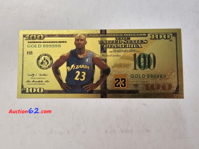Lot 44-8303s - MICHAEL JORDAN NUMBER 23 WIZARDS AND BULLS GOLD PLATED TRIBUTE NOTE. HAS HIS STATS, JERSEY AND A TROPHY ON THE BACK.-T