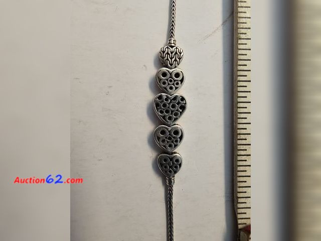 Lot 44-8395w - .925 STERLING SILVER BRACELET WITH MANY DIFFERENT TYPES OF HEARTS.-T