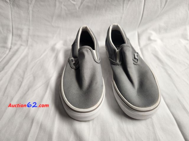 Lot 44-2350b - 1 women's pair Vans slip ons. Size 7. Never worn. See photos. 1. Appears New, A basic inspection has been given to this item. Sold AS-IS. 4....