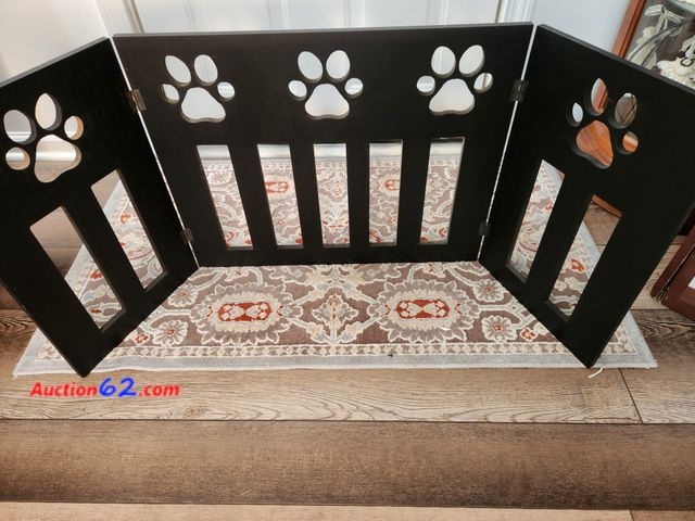 Lot 44-2146g - 1 Pet Store wooden Paw Decor Pet Gate folds in for storage adjusts up to 4 ft wide measures 19 in high. Sells for $55.00 on Ebay. New box da...