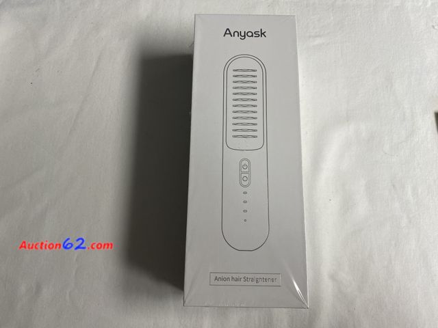 Lot 44-2103f - New. Seal broke to take pictures. Any ask Anion cordless hair straightener. Comes with cord for charging. Clips to hold hair back. . Has com...