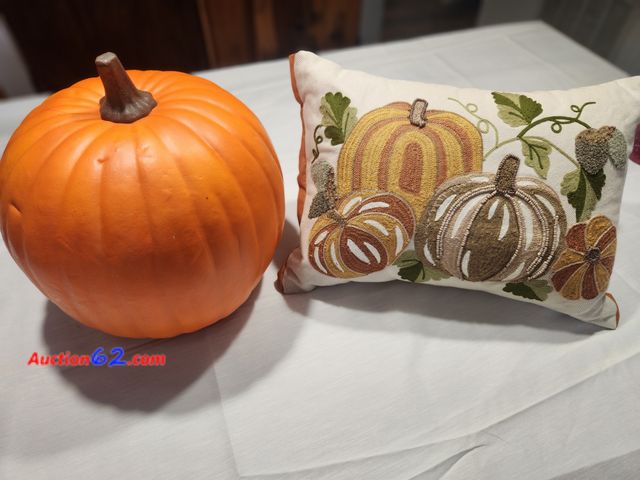 Lot 44-3607m - 1 approx 13 in. High x 11 in wide pumpkin. 1 approx 14 in long x 11 in high tan, orange and cream pumpkin pillow. See photos. Used See All P...