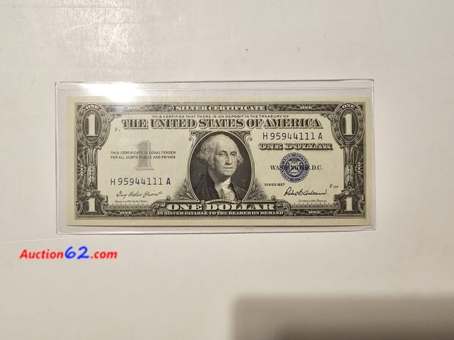 Lot 44-8303w - 1957 SERIES $1 SILVER CERTIFICATE. UNCIRCULATED. FROM BACK IN THE GOOD OLD DAYS WHEN THEY SAID "PAYABLE IN SILVER TO THE BEARER ON DEMAND." ...