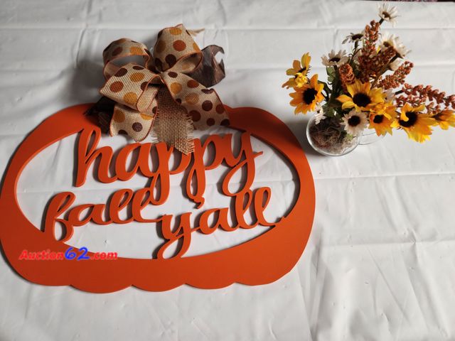 Lot 44-2125g - 1 happy fall yall sign and glass pitcher of fall flowers. Sign measures approx 17 in W x 19 in H. Flowers measure approx 2 in W x 9 1/2 H to...