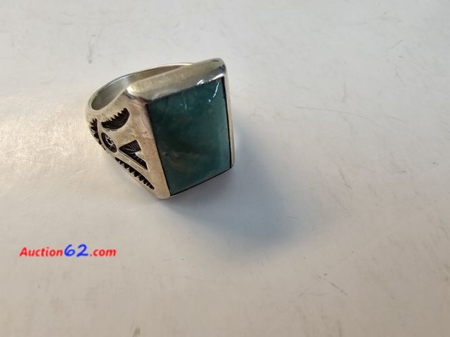 Lot 44-8390w - .925 STERLING SILVER AMERICAN INDIAN RING WITH HUGE GREEN STONE. APPROXIMATELY A SIZE 11. PLEASE LOOK AT THE PHOTO OF THE RING ON THE SIZER ...